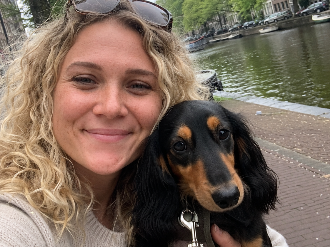 Hannah with a dog during a Maggie visit